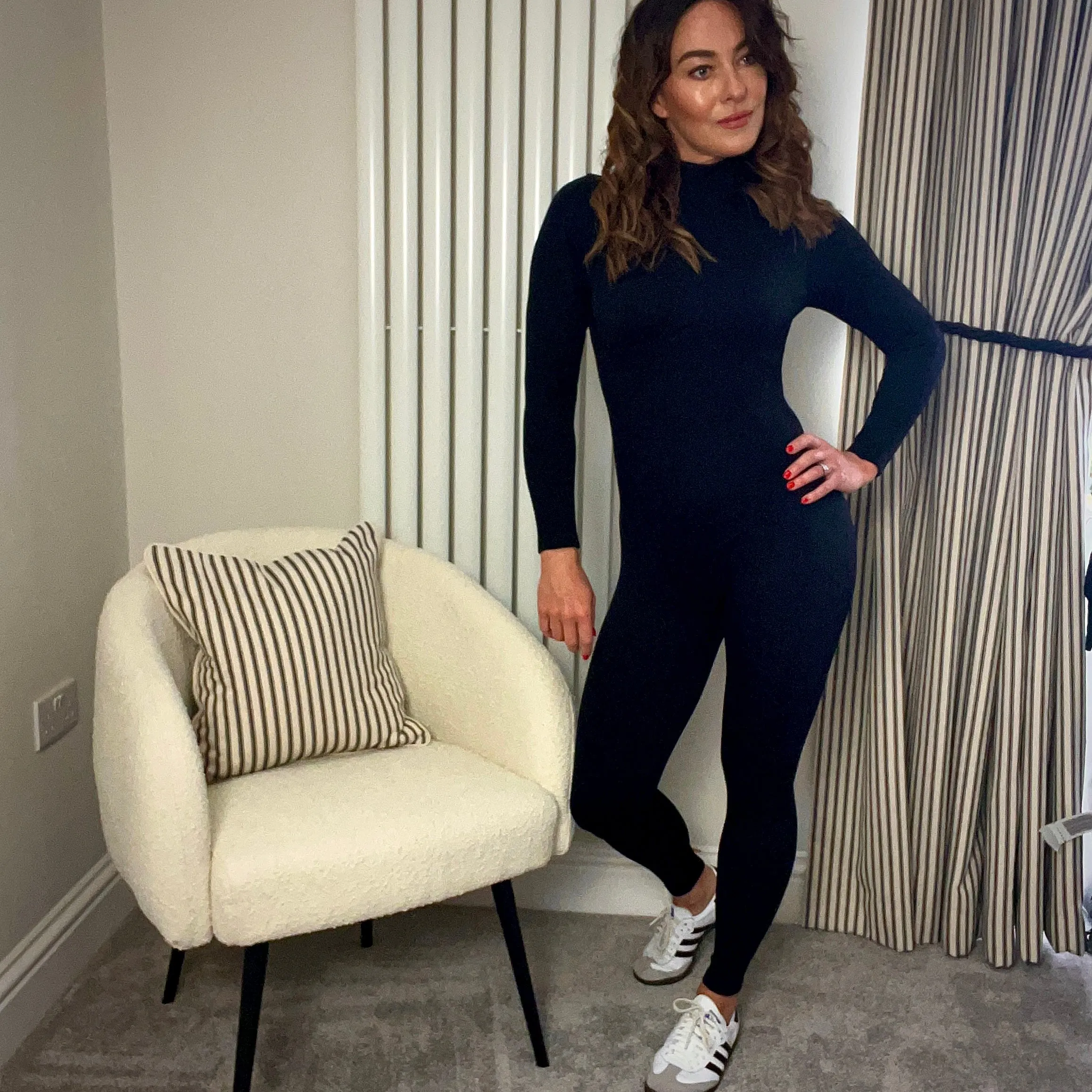 BLACK RIBBED HIGH NECK UNITARD